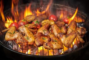 alitas-pollo-plancha-brasa-verduras-asadas-salsa-barbacoa-pepitas-romero-sal-vista-superior-espacio-copia_1150-37780